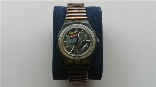 Swatch svoč sat zlatno providni s original narukvi
