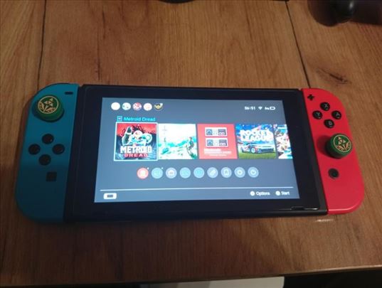Nintendo Switch 1 v2 sa igrama i opremom