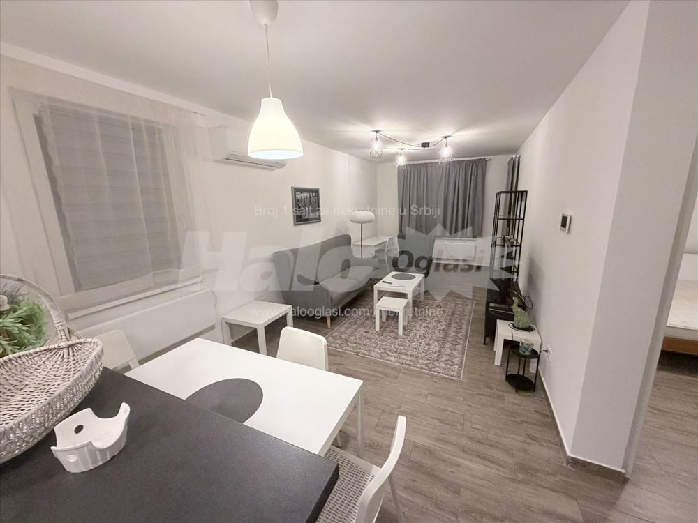 new apartment in a smaller building, with a parking space — photo