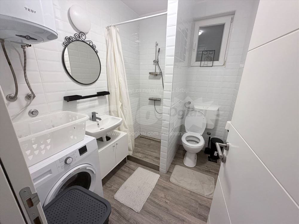 new apartment in a smaller building, with a parking space — photo