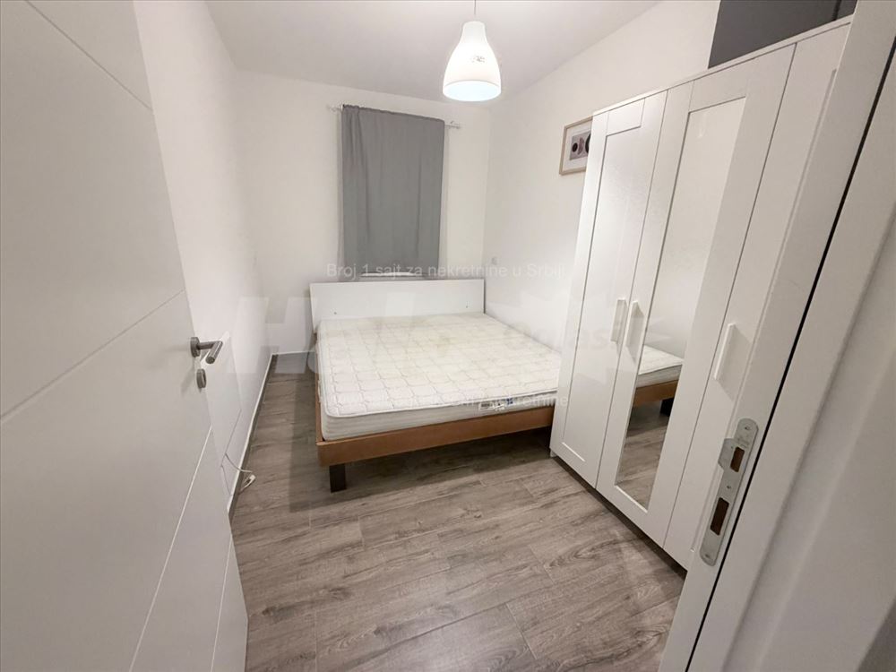 new apartment in a smaller building, with a parking space — photo