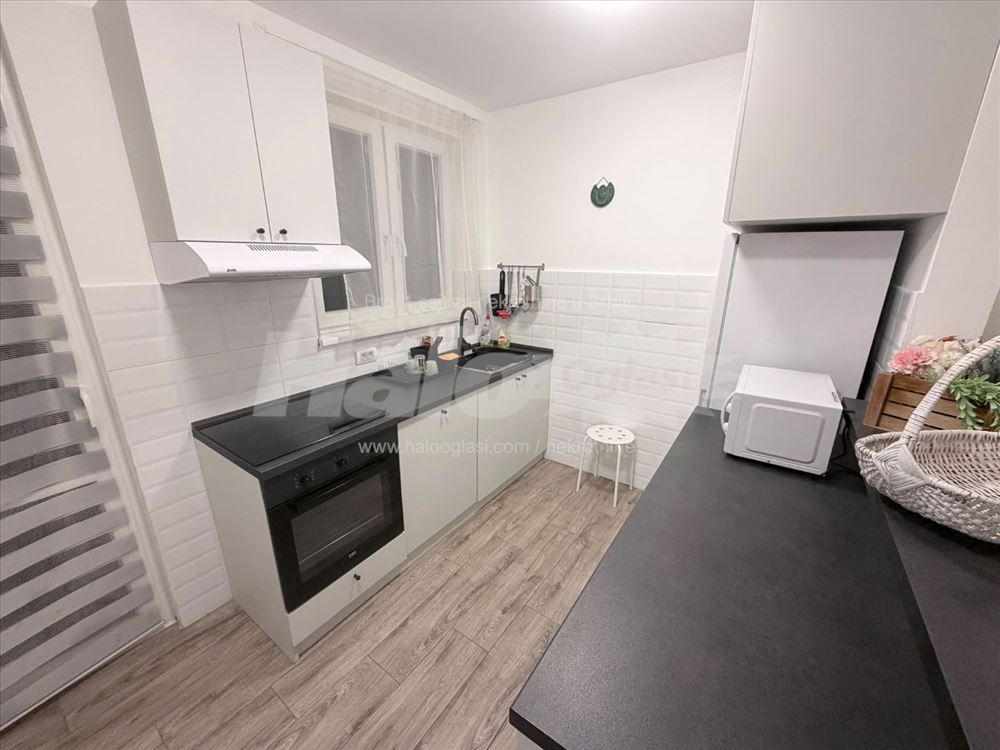 new apartment in a smaller building, with a parking space — photo